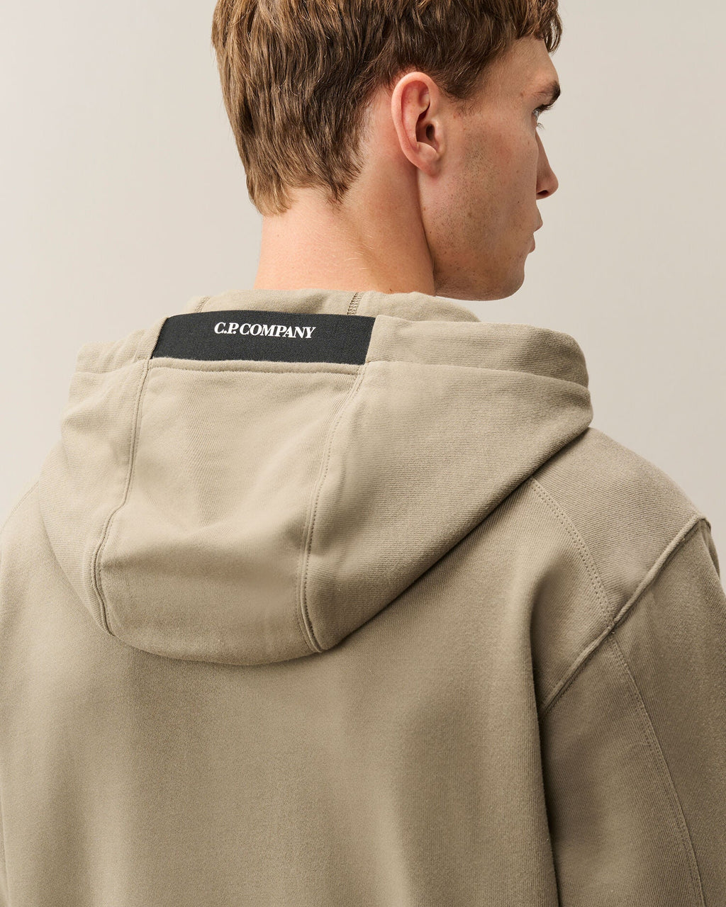 C.P. Company Diagonal Raised Fleece Lens Hoodie in Fallen Rock - Beige