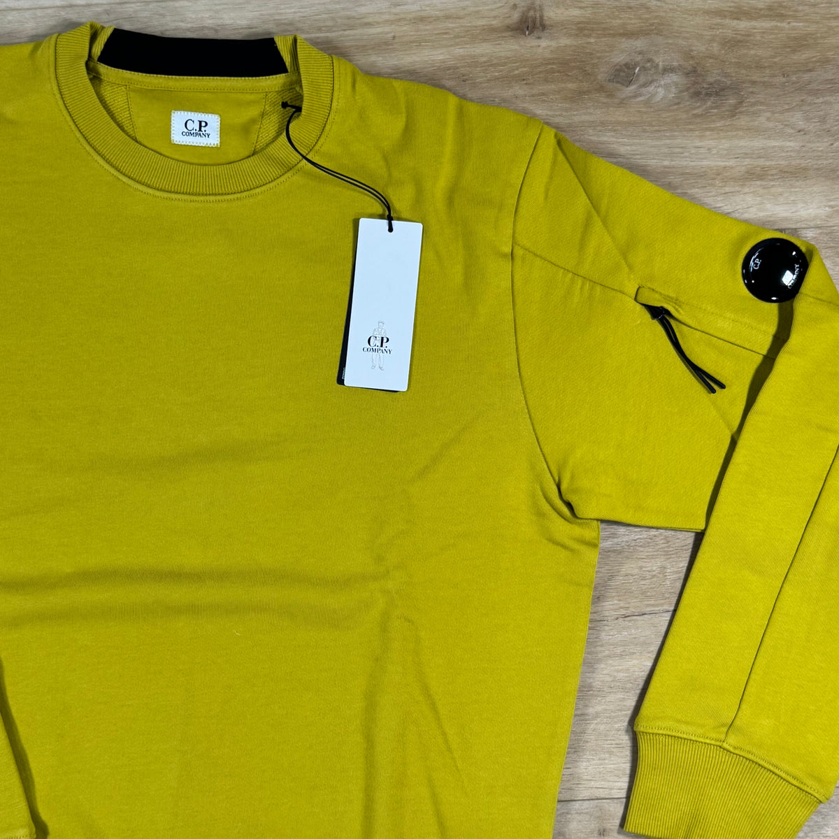 C.P. Company Diagonal Raised Fleece Crewneck Lens Sweatshirt in Antique Moss - Yellow