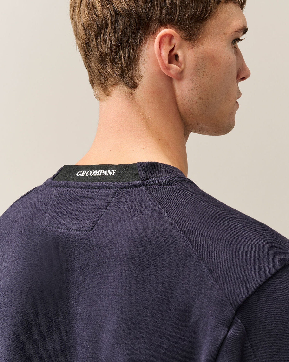 C.P. Company Diagonal Raised Fleece Crewneck Lens Sweatshirt in Navy